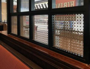 grecian pattern perforated metal in restaurant